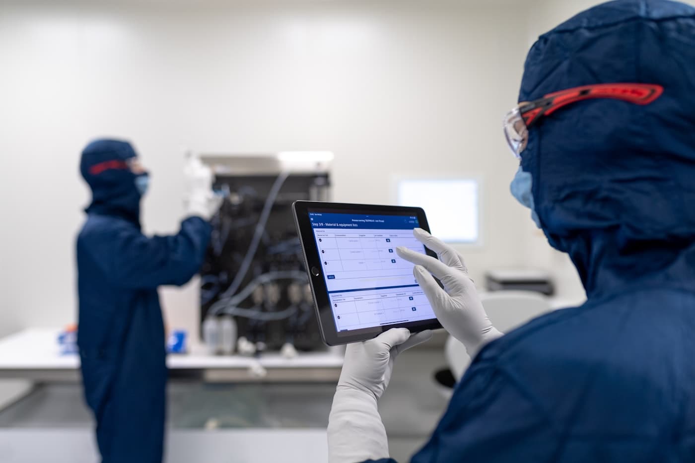 Technician working through a scheduled maintenance checklist on a tablet