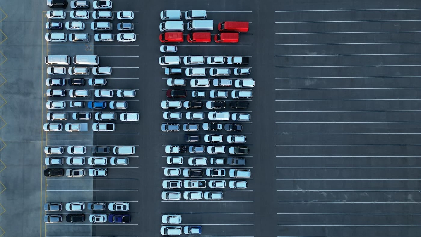 Vans, utes, and cars of a working fleet seen from above