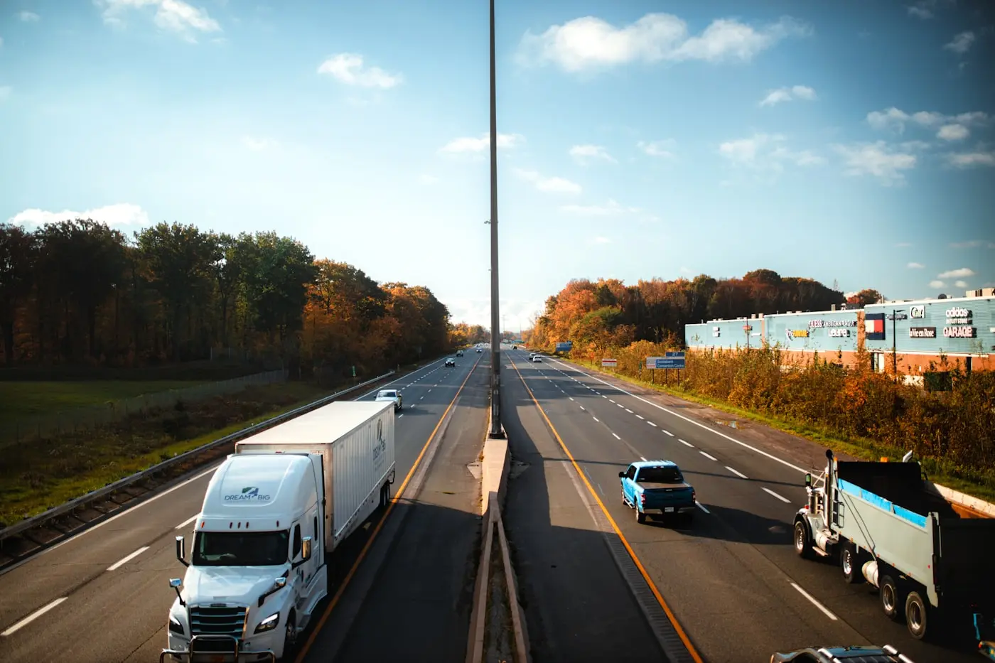 Trucks and work vehicles travelling on a highway